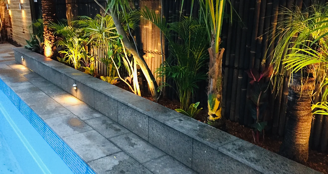 outdoor lights and natural stone pool path